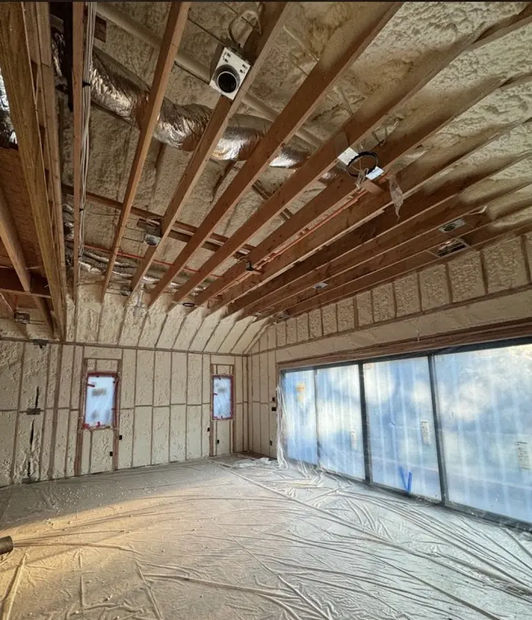 Interior walls and ceiling insulated with spray foam during new construction in Kirkland